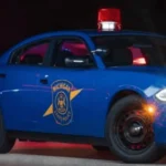Michigan State Police vehicle parked outside an arrest scene in Battle Creek